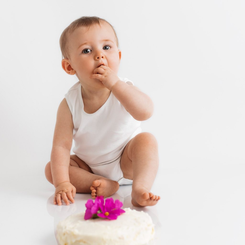 Cake smash photographer in Poole. Simple cake smash photography in white studio, Dorset