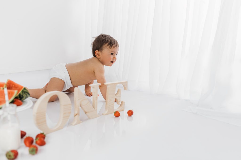 Cake smash photographer in Poole. Simple cake smash photography in white studio, Dorset